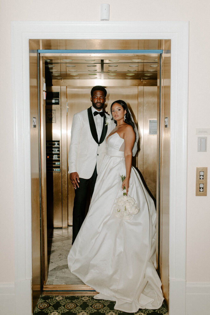 Bride and groom in elevator